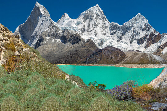 Huandoy snowy mountain and the turquoise Paron lagoon, in Caraz, Ancash, Peru