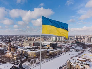 Foto op Plexiglas Ukrainian flag in the wind. Blue Yellow flag in the city of Kharkov © sandsun
