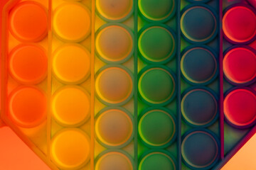 Close up shot of octagon pop it toy on colorful background. Concept