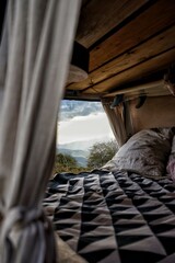 Vanlife in the mountains. View out of the backdoor of a van into the mountains