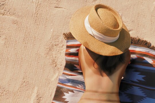 Woman sunbathing on the beach.