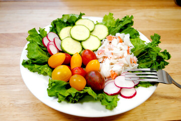 Fresh Salad Lunch with Seafood salad, tomatoes, radishes and Zucchini Slices