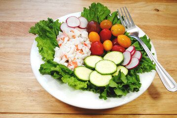 Fresh Salad Lunch with Seafood Salad, Tomatoes, Radishes and Zucchini Slices