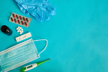 Top view of a group of medical objets on a blue background
