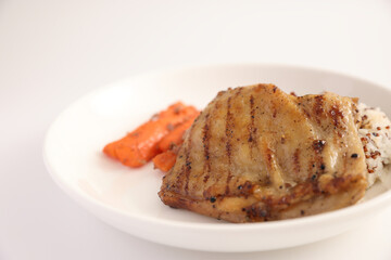 Grilled chicken with rice isolated in white background