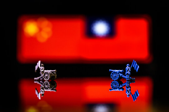 Conceptual image of war between China and Taiwan using toy soldiers and national flags