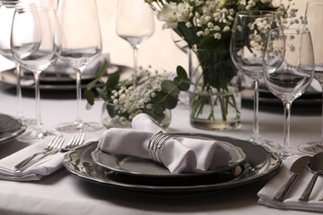 Stylish elegant table setting for festive dinner in restaurant