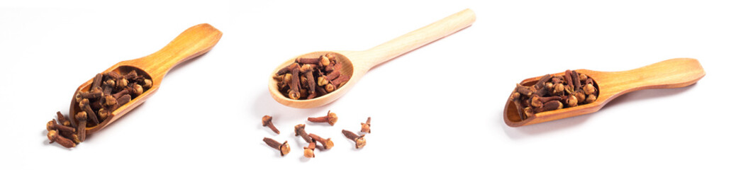 Set of spice clove (Syzygium aromaticum) in wooden spoon and scoop, scattering on white background isolated. Close up, macro