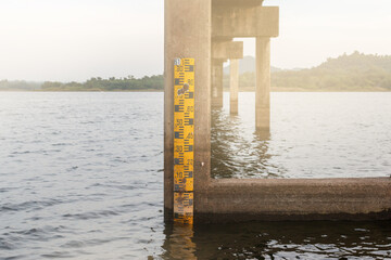 Drought crisis: Water level gauge or staff Gauge at Nong Klang Dong Reservoi, Chonburir. Water...