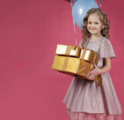 Cute girl with curly hair with gift boxes,a place to copy