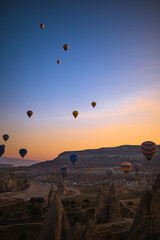 GOREME, TURKEY - SEPTEMBER 18. 2021: Bright hot air balloons in sky of Cappadocia, Turkey