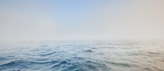 Baltic sea in a morning fog at sunrise, Sweden. Soft sunlight, picturesque scenery