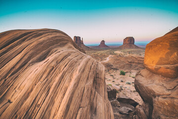 Beautiful sunset over the West, Mitten and East Butte in Monument Valley. Utah, USA.
