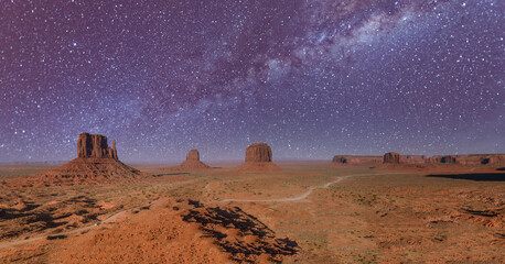 Amazing starry night over Monument Valley, USA. Aerial panoramic view.