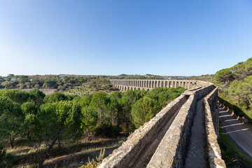 Tomar Aqueduct or Aqueduto de Pegoes, ancient stone masonry building, amazing monument. It was...