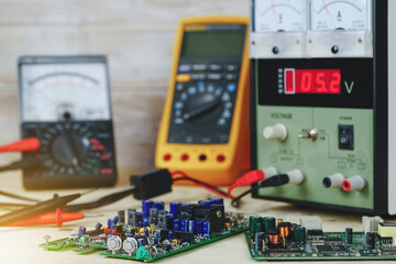 Electronics Repair Table - Electronic board inspection area and make electrical measurements, laboratory adjustable power supply and multimeters.   