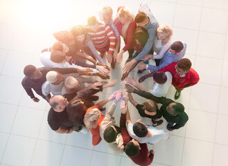 Group of people with hands together - teamwork concepts