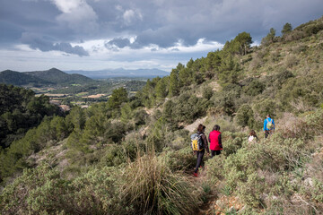 family hiking in Puig de Cura, Randa, Algaida, Randa, Algaida, Mallorca, Balearic Islands, Spain