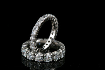 Diamond jewelry. Diamond rings on black background