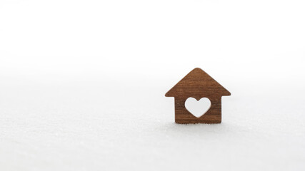 Obraz na płótnie Canvas Wooden house in the snow. Cozy home concept