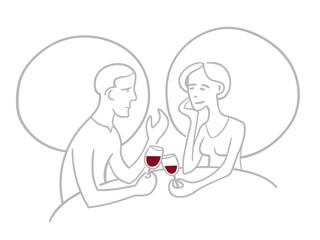 Romantic couple sitting in restaurant drinking wine and having a conversation.   
