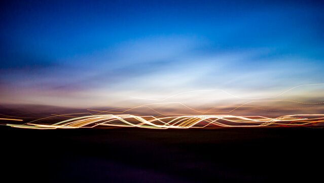 Light trails accross a dark evening sky 