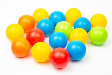 Colored plastic balls on white background. leisure and game items. round objects