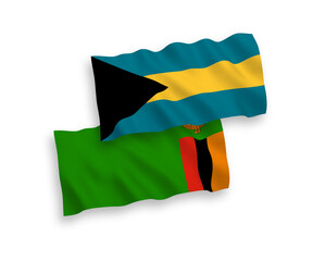 National vector fabric wave flags of Republic of Zambia and Commonwealth of The Bahamas isolated on white background. 1 to 2 proportion.