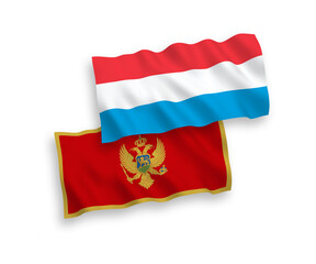 National vector fabric wave flags of Montenegro and Luxembourg isolated on white background. 1 to 2 proportion.