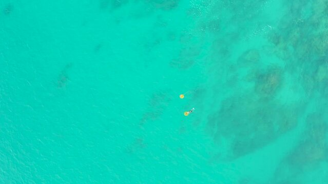 LAGUNA BEACH LOS CABOS BCS MEXICO-2021: Swimmer Paddles In Ocean