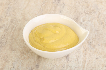 Organic mustard sauce in the bowl