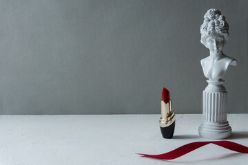 Red lipstick on a light background. copy space.