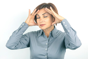 Beautiful young business woman with closed eyes thinks over her project on a white background. thoughts and stress. relaxation and emotions