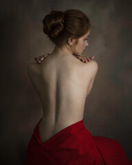 Back of a graceful girl in a red skirt