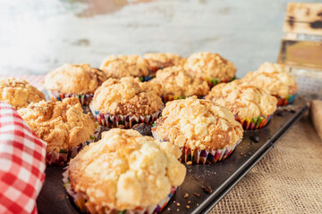 Baking tray with delicious freshly baked homemade cupcakes or muffins. High view. Concept natural food, homemade food.