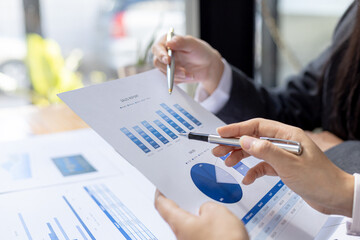 The sales department is having a monthly summary meeting to bring it to the department manager, they are verifying the correctness of the documents that are prepared before bringing in to the manager