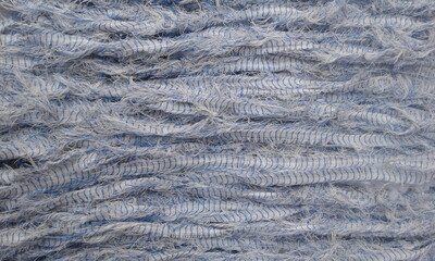 Texture background, blue tattered fabric