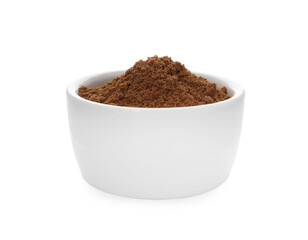 Bowl with nutmeg powder on white background