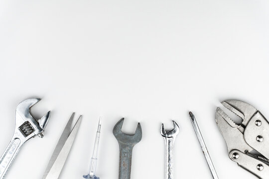 Worktable top view of Repair tools Flat lay composition on white background, construction and home DIY, space for text