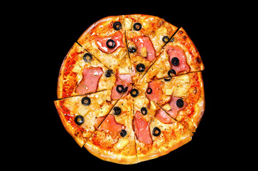 Pizza, a traditional Italian snack. Lots of ingredients, cheese, ham, olives, sauce, pineapple. Top view, round cut into pieces. Isolated on black background.