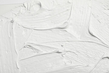 Texture of white oil paint as background, closeup