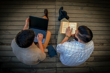 Conceptual photography: old and new source of information. Digital gadget as upgrade of book....