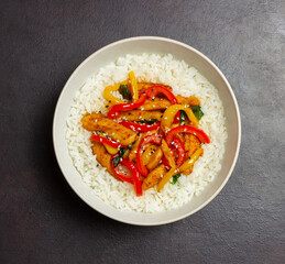 Rice with fried chicken, pepper and sesame. Asian food.