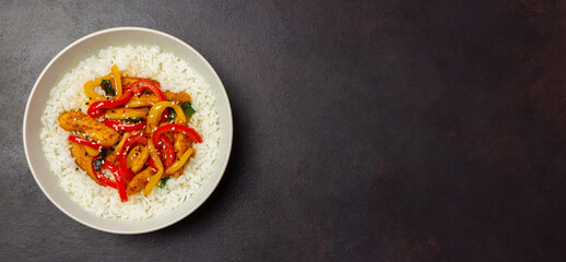 Rice with fried chicken, pepper and sesame. Asian food.