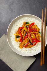 Rice with fried chicken, pepper and sesame. Asian food.