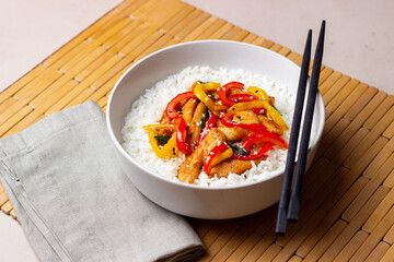 Rice with fried chicken, pepper and sesame. Asian food.