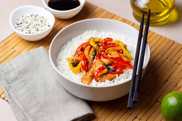 Rice with fried chicken, pepper and sesame. Asian food.