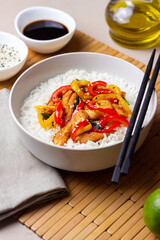 Rice with fried chicken, pepper and sesame. Asian food.