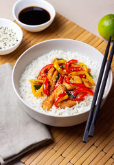 Rice with fried chicken, pepper and sesame. Asian food.