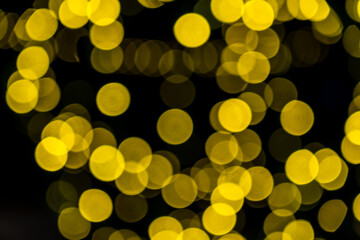 Elegant and romantic golden Christmas lights background with bokeh